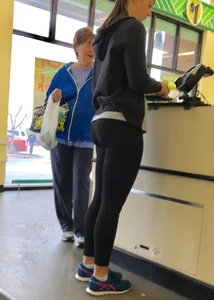 Thick booty girl shopping at Dollar Tree in leggings