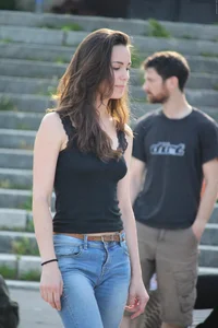 Hot brunette skateboarder in tight jeans and with hard nipples