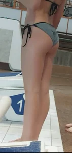 Closeups of a booty and legs at the pool, candid teen in swimsuit