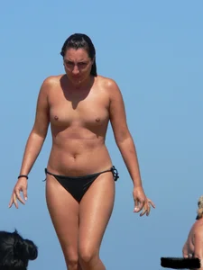 Bunch of sexy babes on the beach topless and in thong bikinis