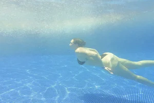 Underwater pictures of pretty Mexican with nice tits and ass