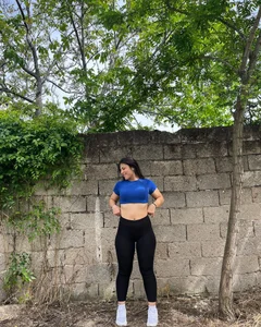 Nice non-candid girl in a top and leggings showing off her tummy