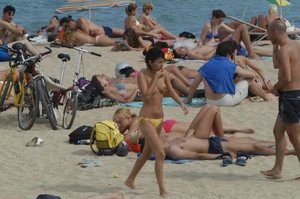 Topless girls on a beach in Barcelona