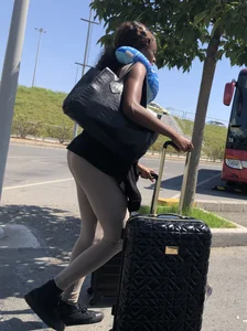Sexy black lady wearing leggings, slim legs and firm booty