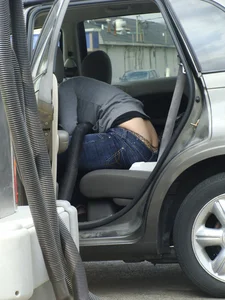 Girl cleaning her car in jeans and showing some cheetah print underwear