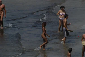 Girls on a nude beach in Sitges, Spain