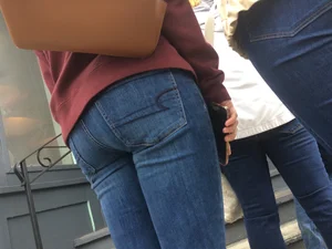 2 nice asses in tight jeans standing around
