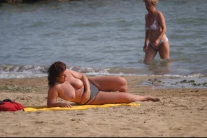 Girls on a nude beach in Bibione, Italy
