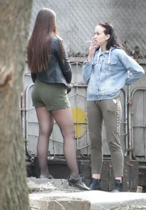 Hot girl wearing shorts and pantyhose smoking with her friend on the street creepshots, great ass