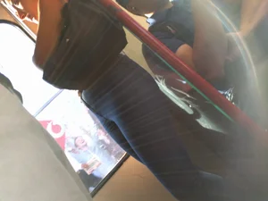 Train girl in tight jeans with a nice ass standing around