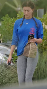 Hot college girl getting food in grey leggings