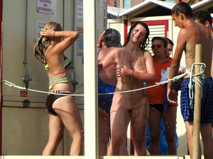 Only one is nude - group photos where only 1 girl is naked, and the rest of the people are dressed