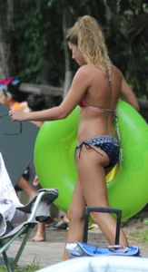 Blonde bikini girl at the pool in pink bikini top with amazing tits