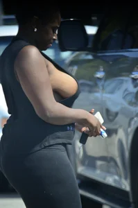Chubby black lady with big tits and no bra lets it slip