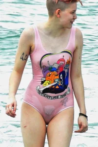 Miley Cyrus' friend in pink see through swimsuit showing nipples and pussy hair