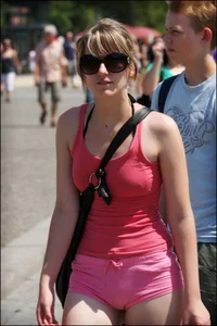Girl showing serious ass cheeks and great ass in tiny pink shorts