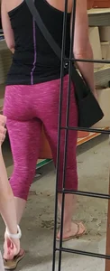 Milf shopping with a nice ass in tight maroon leggings