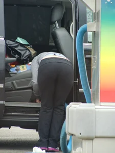 Girls cleaning their cars in jeans and pants