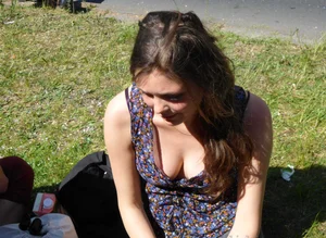 2 sexy girls showing nice cleavage while sitting together