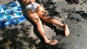 Sexy bikini ass laying out on the rocks up close