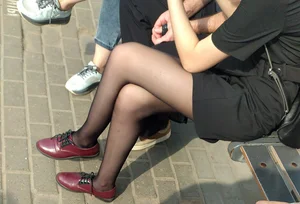 Girl in Black Pantyhose Sitting with Crossed Legs on the Street Bench Creepshot