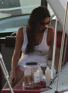 Bikini babe on a boat with a wet see through white shirt showing her tits