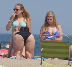 3 girls on the beach in bikinis with big boobs, one brunette and two blondes