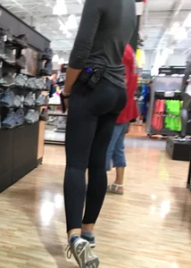 Shoe store employee with a sexy bubble butt in leggings