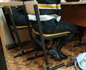Skinny Legs of a College Teen Classroom Closeups - Green Checkered Pants And Black Dotted Pantyhose With a Hearts Pattern