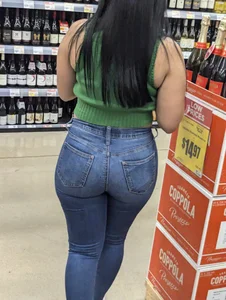 Sexy Latina buying wine