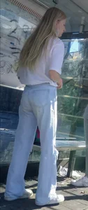 Skinny blonde girl wearing light blue jeans street creepshot