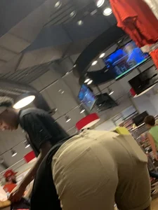 Bunch of girls in various outfits at a Cardinals baseball game