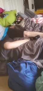 Candid girl in spandex shorts and socks lying in bed home creepshot