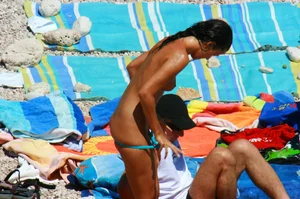 Ula FKK Sexy brunette on a nude beach topless, bottomless and with blue thong