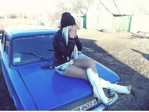 Suburb Candid Girl with Hot Legs Sitting on a Car Hood