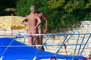 Sexy and skinny blonde nudist milf on the beach