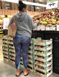 Latina milf grocery shopping in patterned leggings
