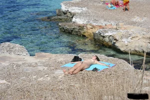 Bunch of sexy ladies on a nude beach