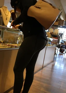 Brunette jewelry shopping in leggings with a nice ass