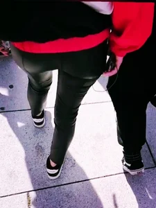 Ass in leather pants closeups on the street