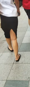 Mature Wife's Legs And Feet in Flip-Flops on the Street