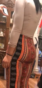 Big fat ass in pattern flare pants with some pokey pierced nipples in a blue crop top