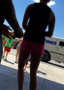 Sexy girl with a nice ass in tight pink spandex shorts