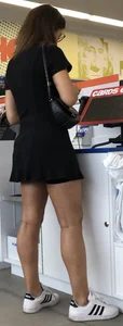 Brunette in glasses and a black dress