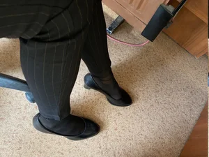 Closeups of college girls' legs and feet in pantyhose and various shoes (including high heels) in classrooms
