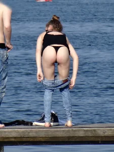 Girl on the water in black thong bikini with a nice ass