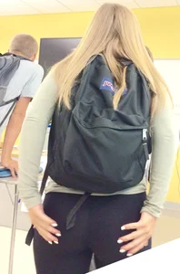 Blonde College Girl in Leggings Touching Her Ass in Class
