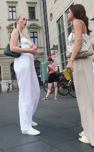 Long blonde braless in a white outfit (many pictures)