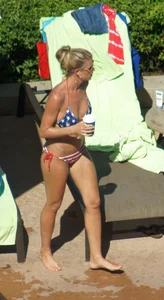 Blonde babe at the pool with sexy body in USA bikini