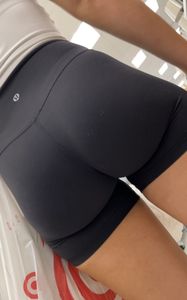 Stunning ass in spandex shorts and legs at the supermarket, skillful closeups